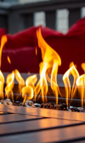 A fire pit table with close up flames